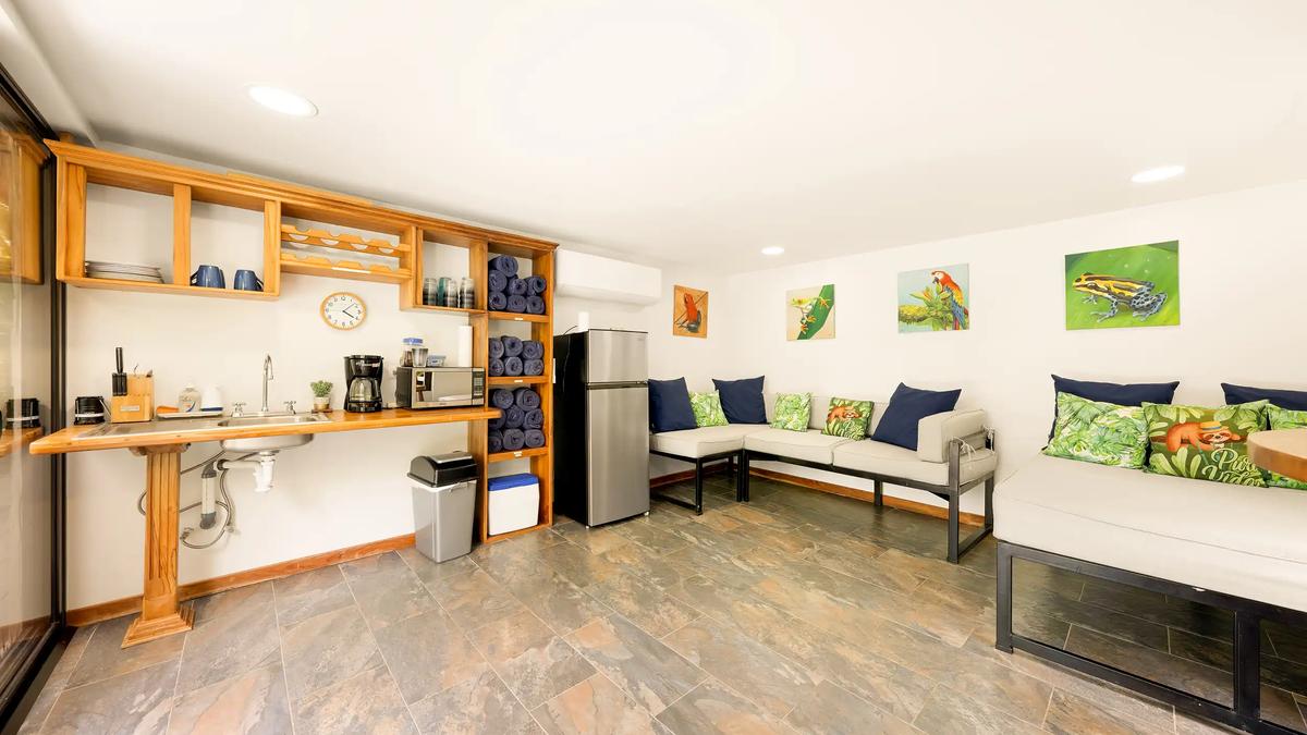 Pool lounge kitchenette at Casa Vista Verde with sink, coffee maker, and fridge