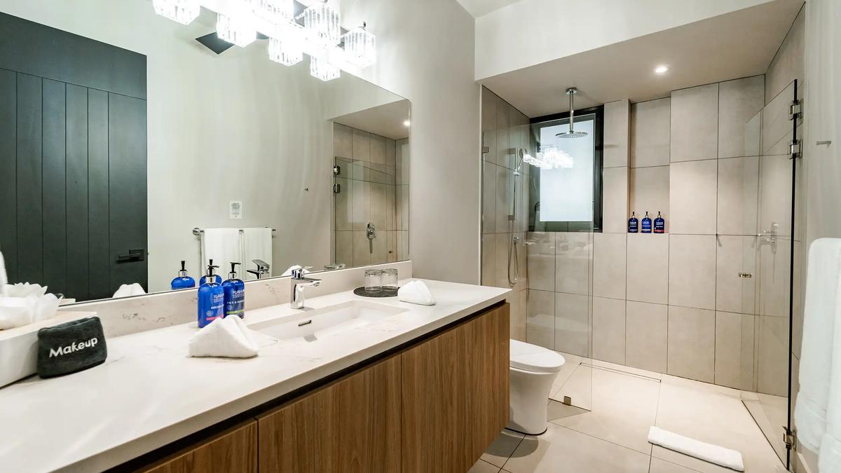 Modern bathroom at Casa Blue Marlin with double vanity and walk-in rain shower