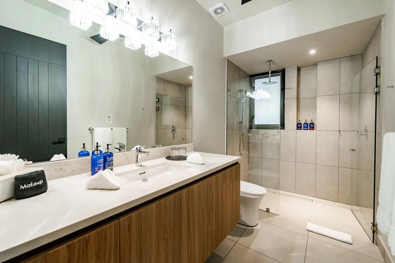 Modern bathroom at Casa Blue Marlin with double vanity and walk-in rain shower