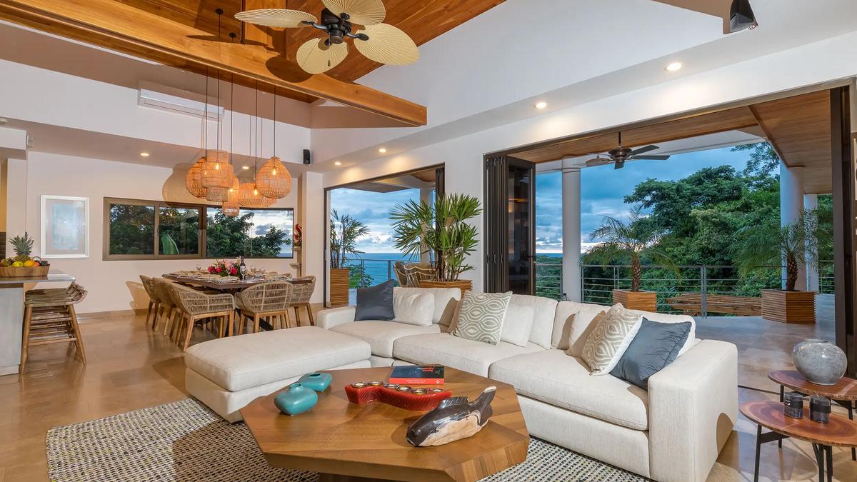 Open living room at Casa Anjali with sectional sofa and ocean view