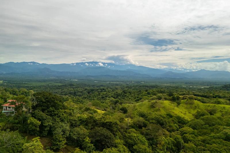 View from above Casa Vista Verde across the jungle valley to distant mountains