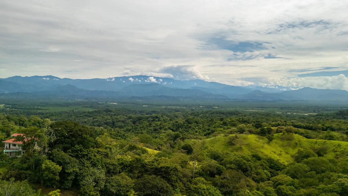 View from above Casa Vista Verde across the jungle valley to distant mountains