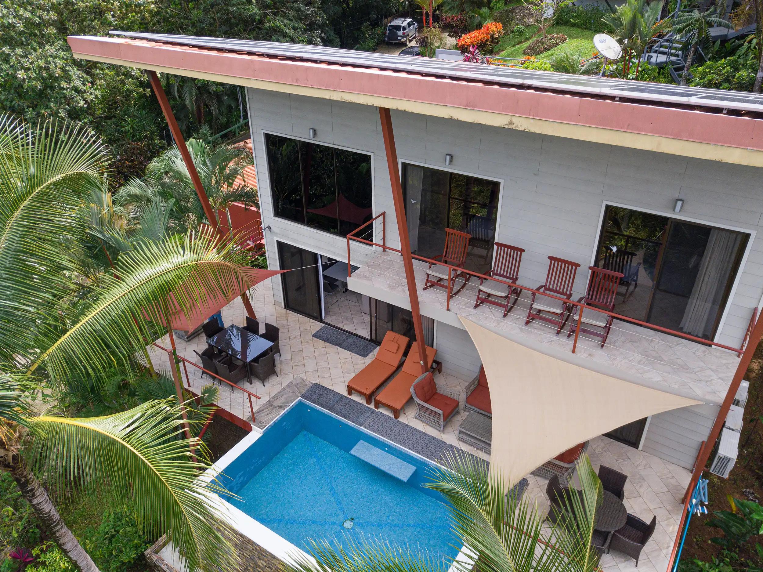 Drone view of the two story Casa Serenidad with plunge pool and shade sails