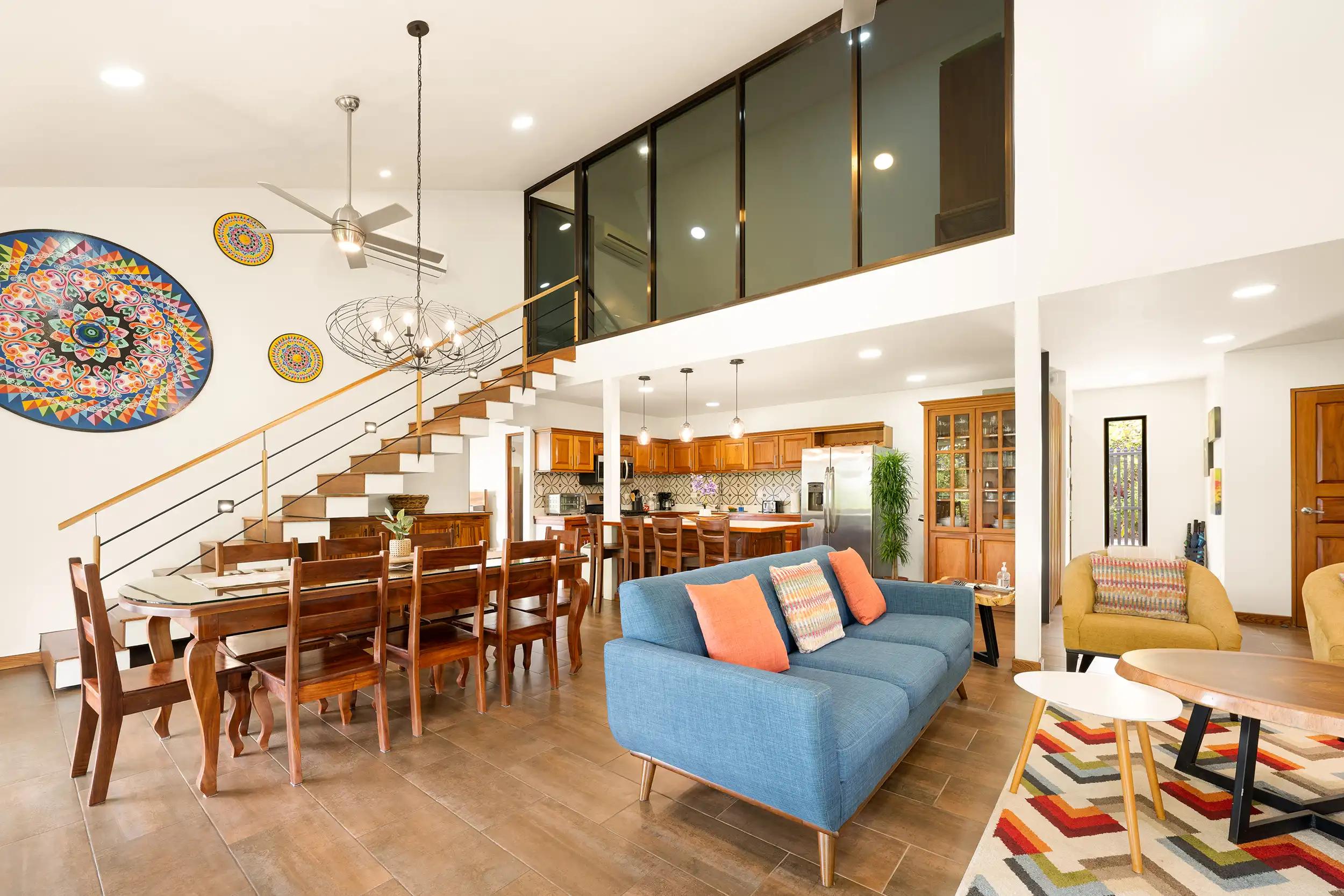 Living and dining space at Casa Vista Verde beneath the loft with lights on