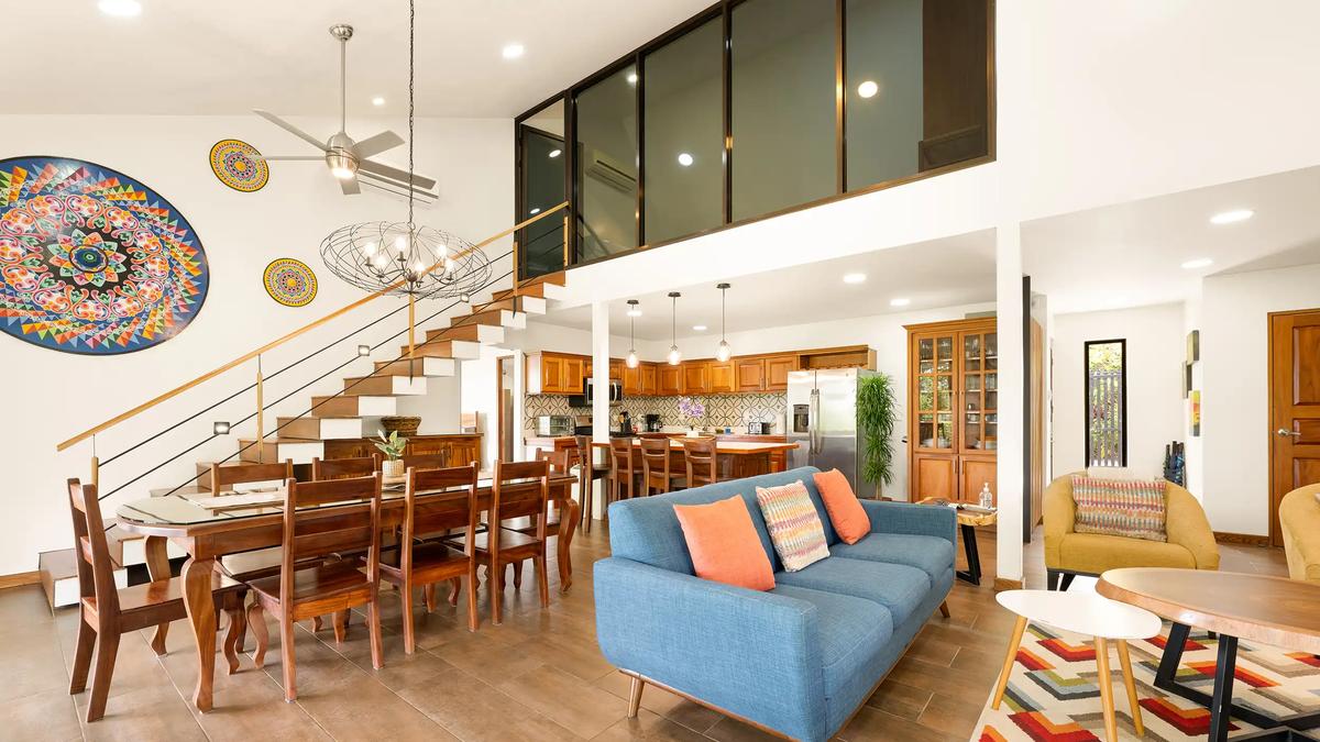 Living and dining space at Casa Vista Verde beneath the loft with lights on