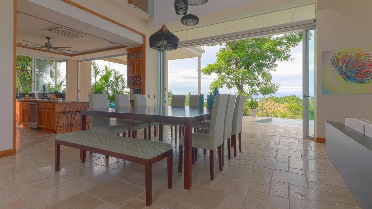 Casa Contee dining table for ten beside the open kitchen and pool terrace