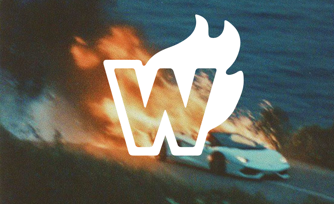 Wicked Reports mark in flames beside a sports car