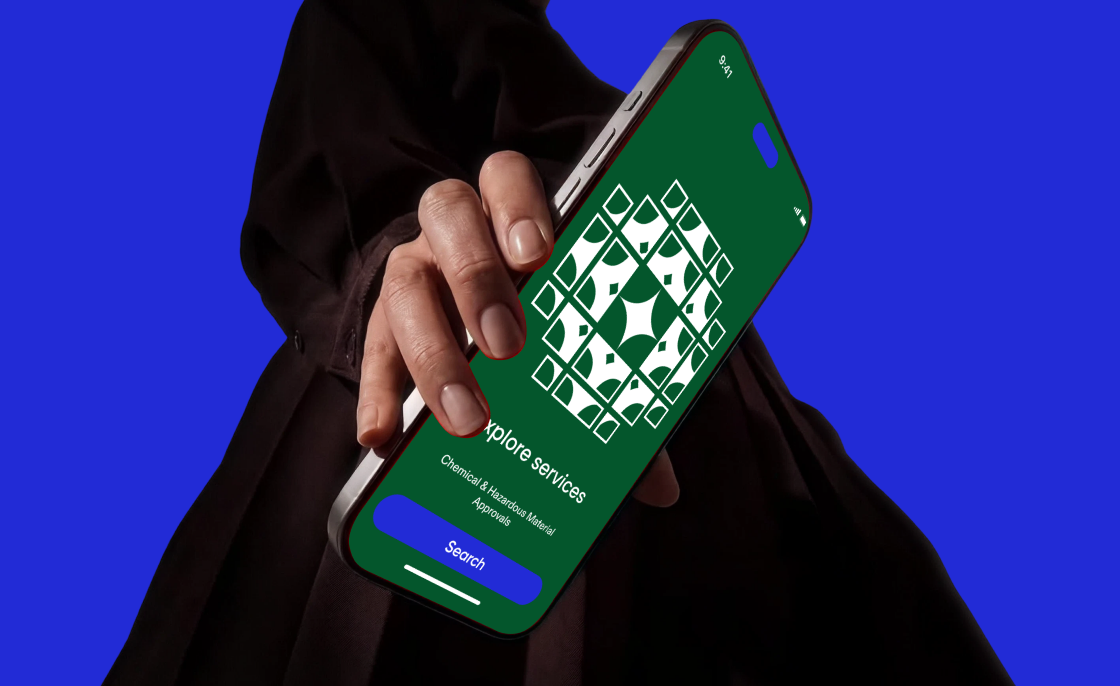 Hand holding a phone with the portal splash screen