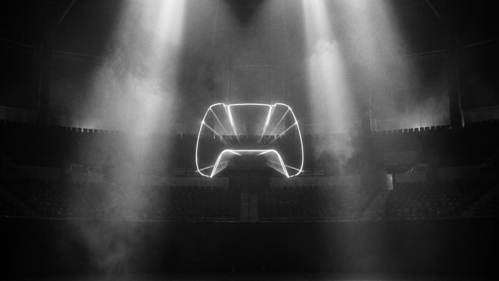 A glowing game controller silhouette in a dark arena