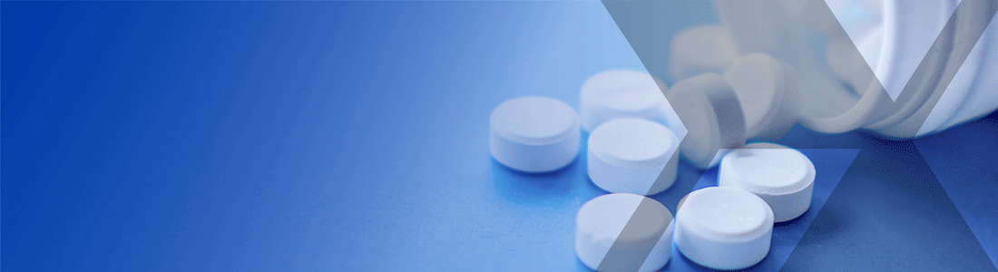 bottle of unlabeled, generic white tablet pills on a blue background