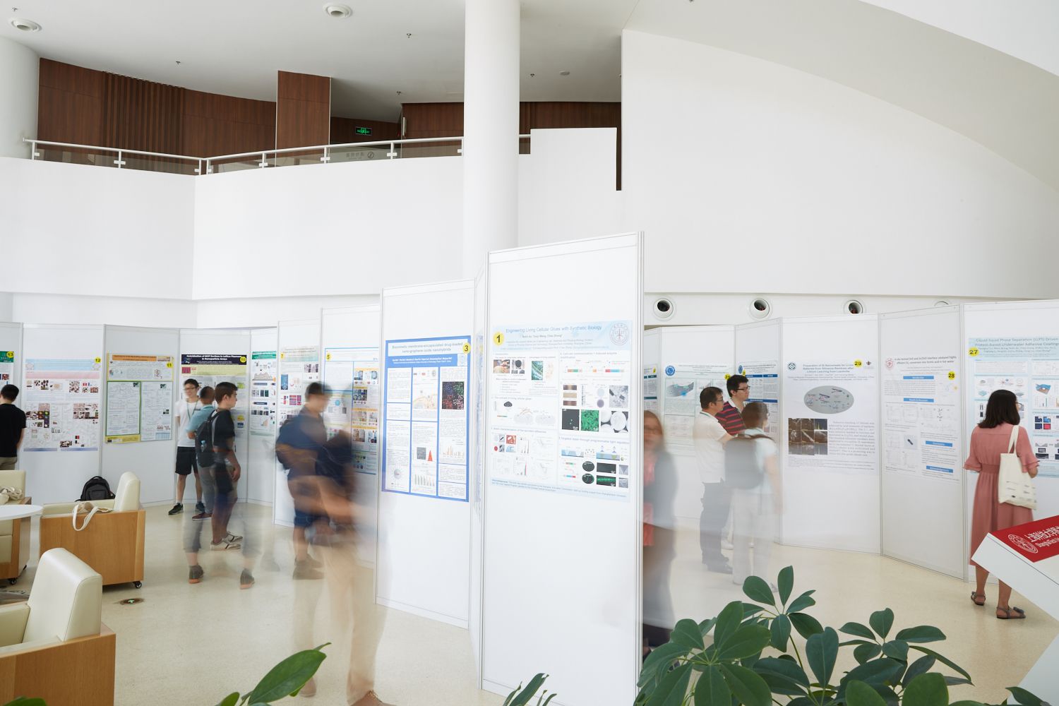 Symposium attendees viewing the student posters on display. Photography: Fei Luo.