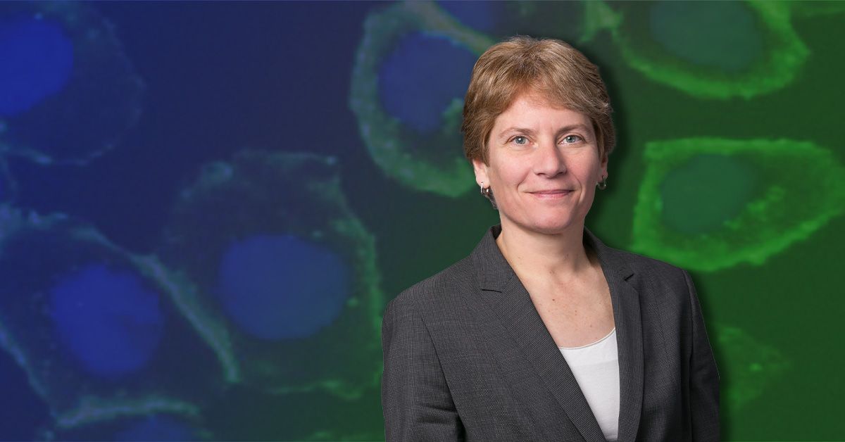 Carolyn Bertozzi Headshot on top of blue and green background
