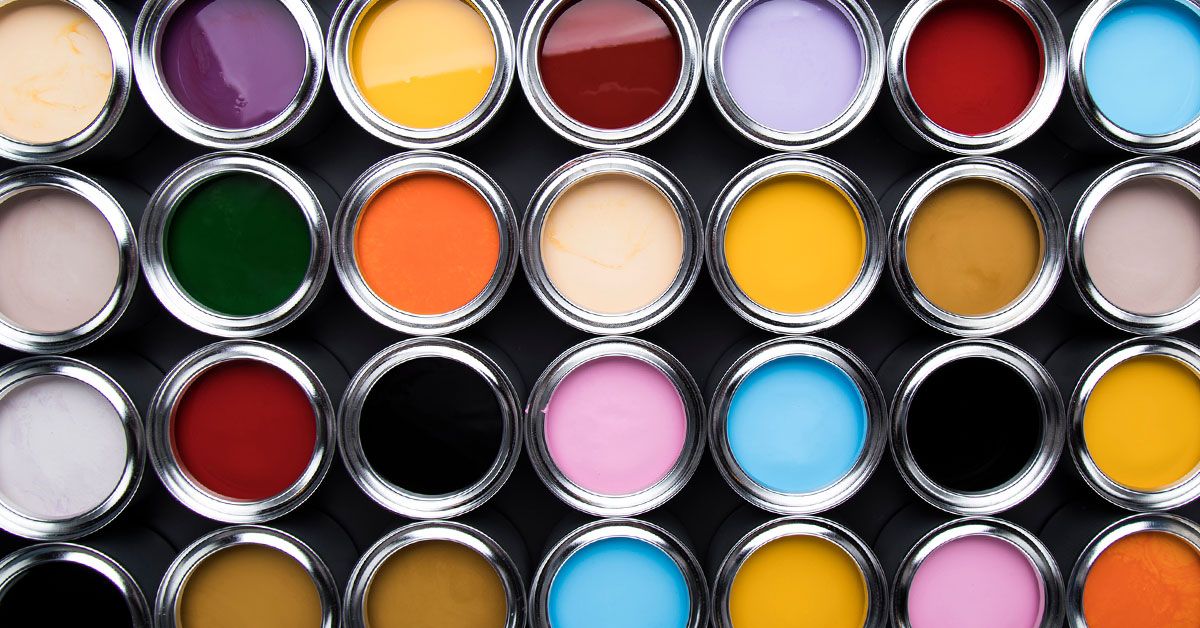 A row of paint cans with different colors.