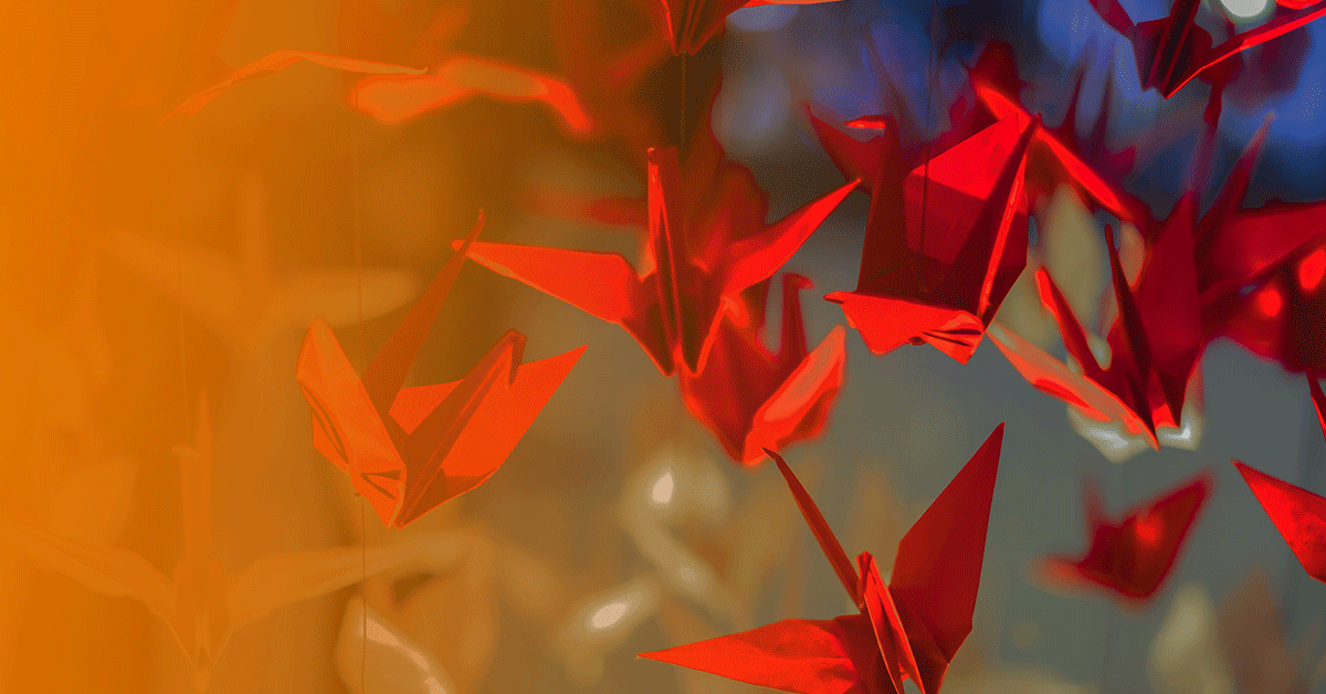 collection of hanging red paper cranes