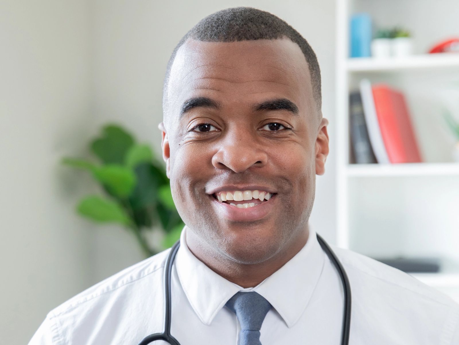 Doctor with stethoscope around his neck representing physician leadership