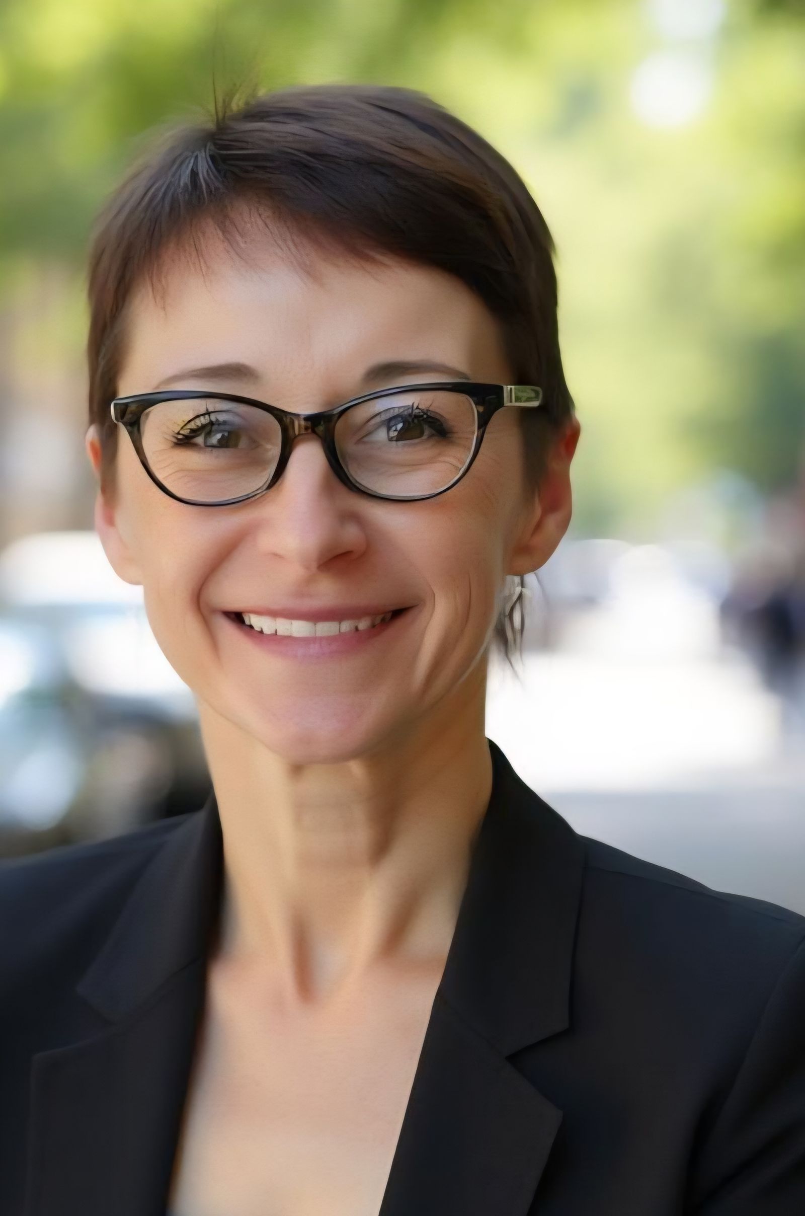 Portrait of Linda Anegawa, CMO, smiling in an office setting
