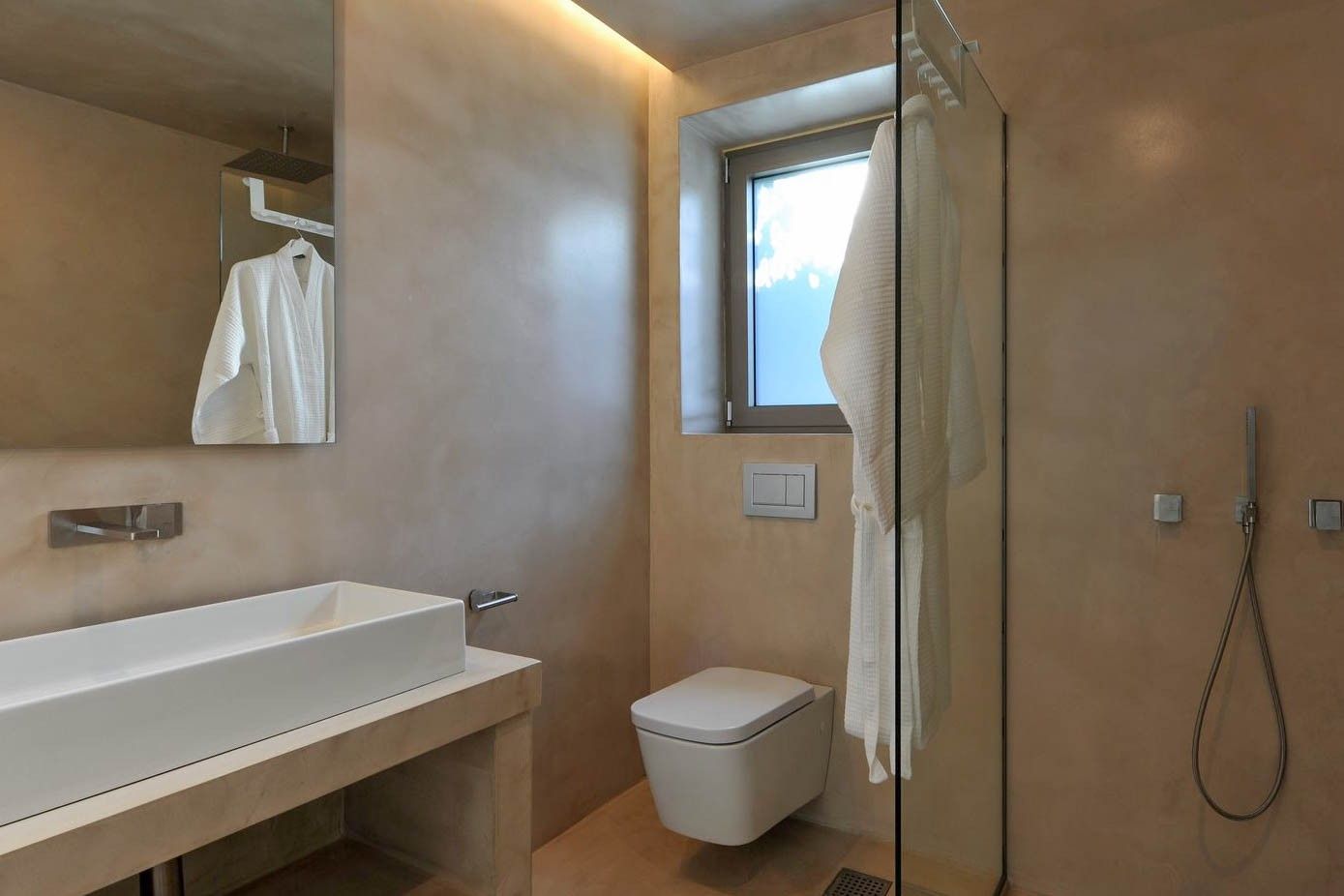 Sleek, modern bathroom with neutral tones and luxury fittings.