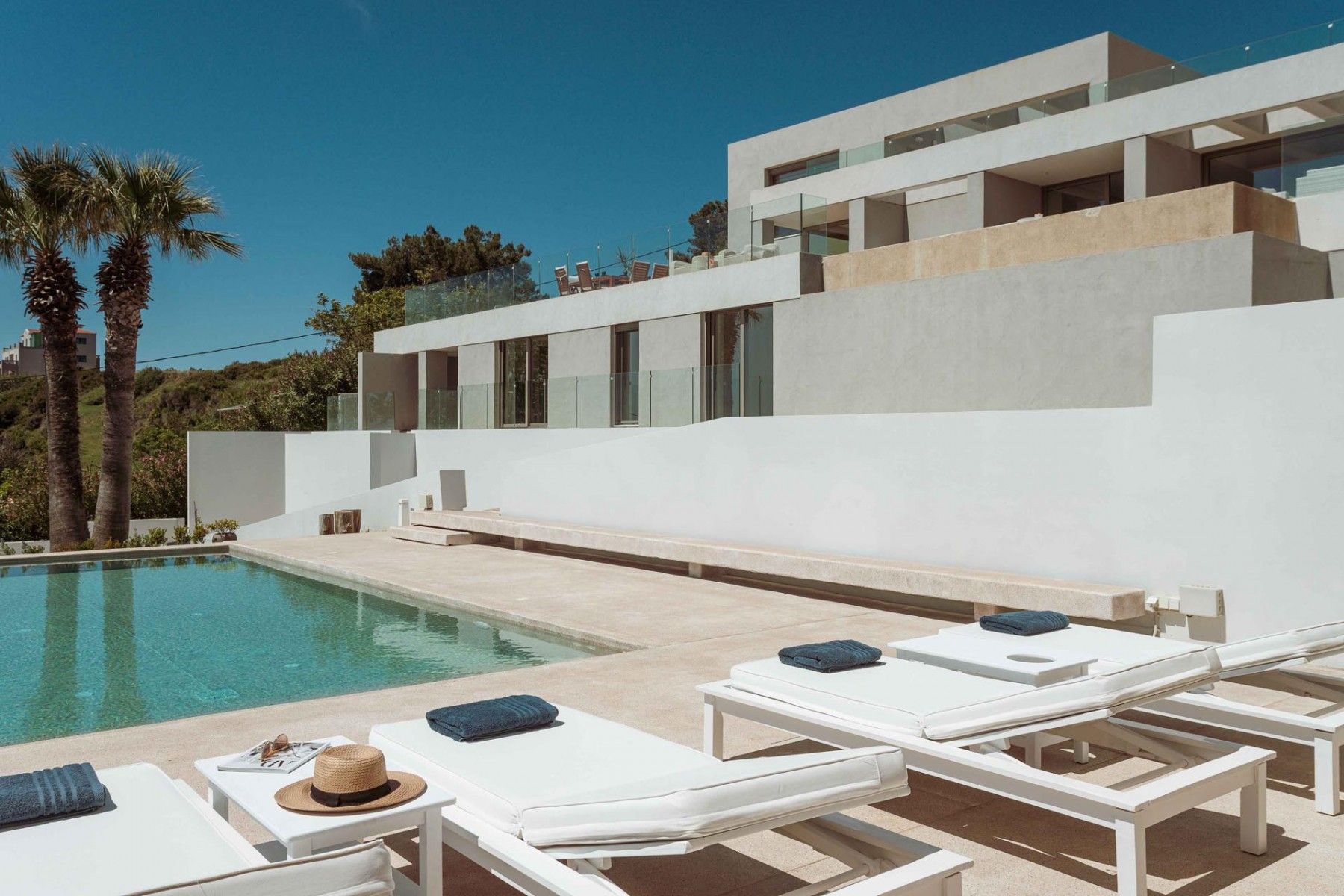 A spacious pool area bathed in the morning sun, highlighting the villa’s design.