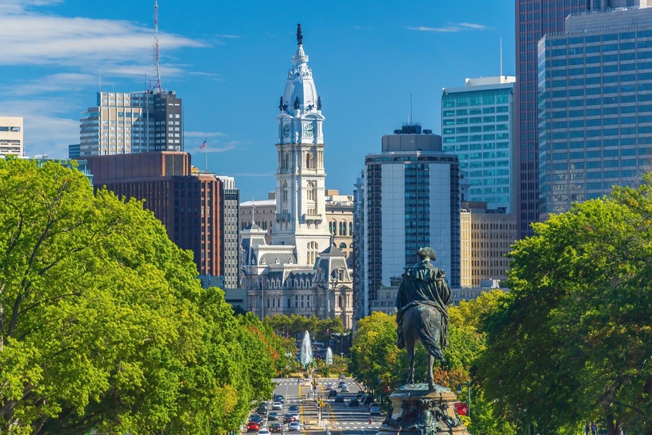 Philadelphia City Hall framed by the Benjamin Franklin Parkway and the center city skyline.