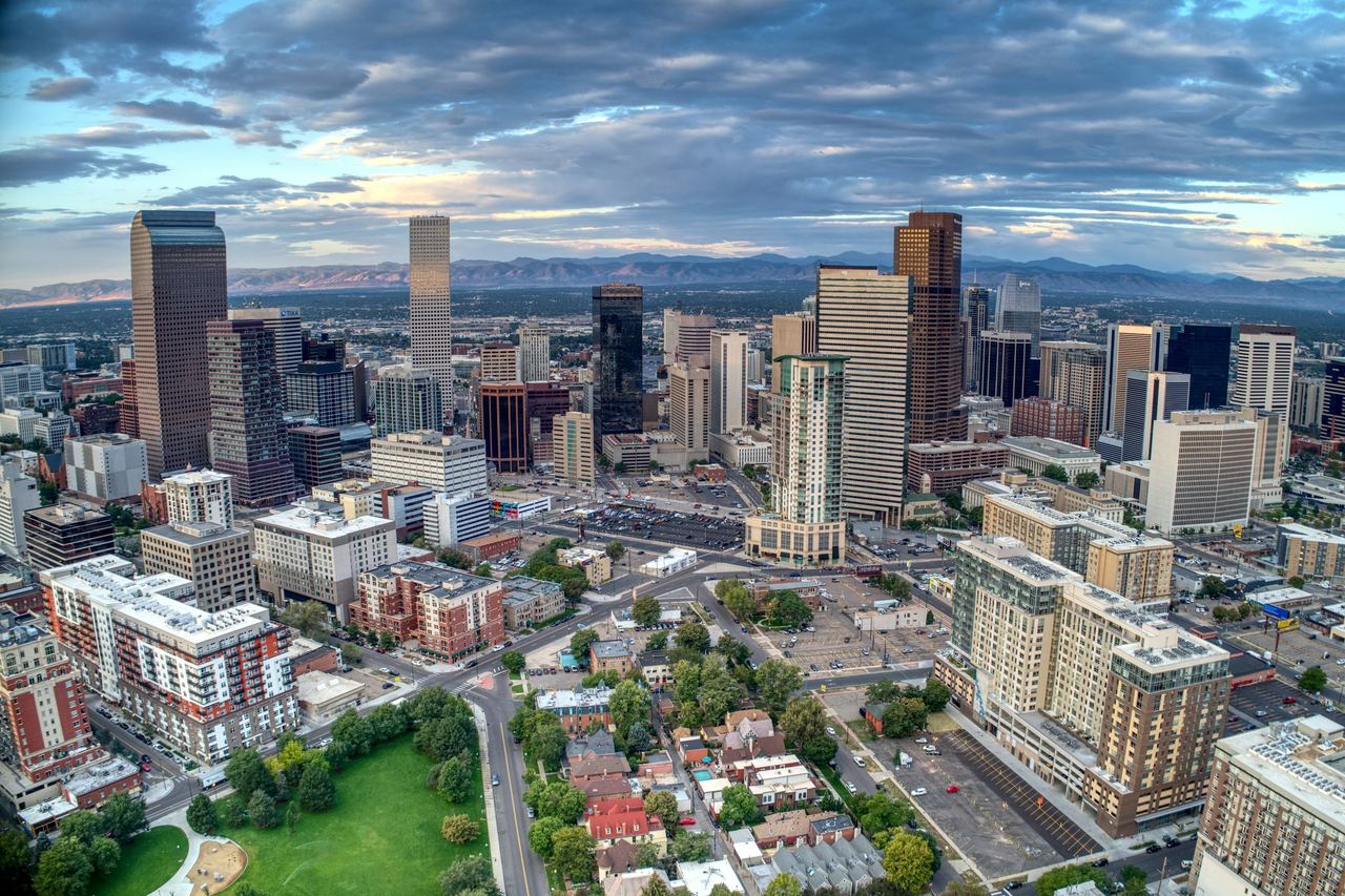 Daybreak over downtown Denver with a view of the Rocky Mountains to the west