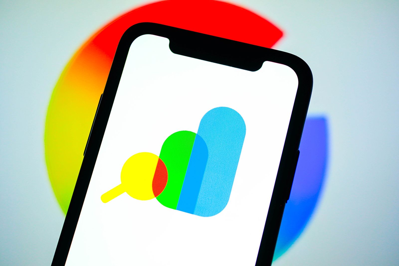 Phone displaying the Google Search Console logo against a colorful blurred backdrop