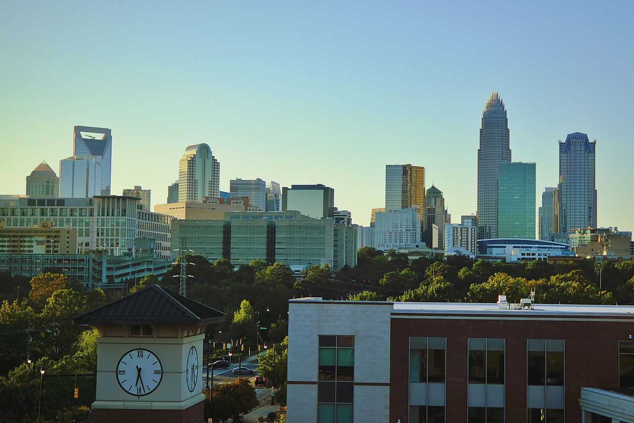 A horizon view of the Charlotte, North Carolina metropolitan area with a robust, sky-blue aesthetic