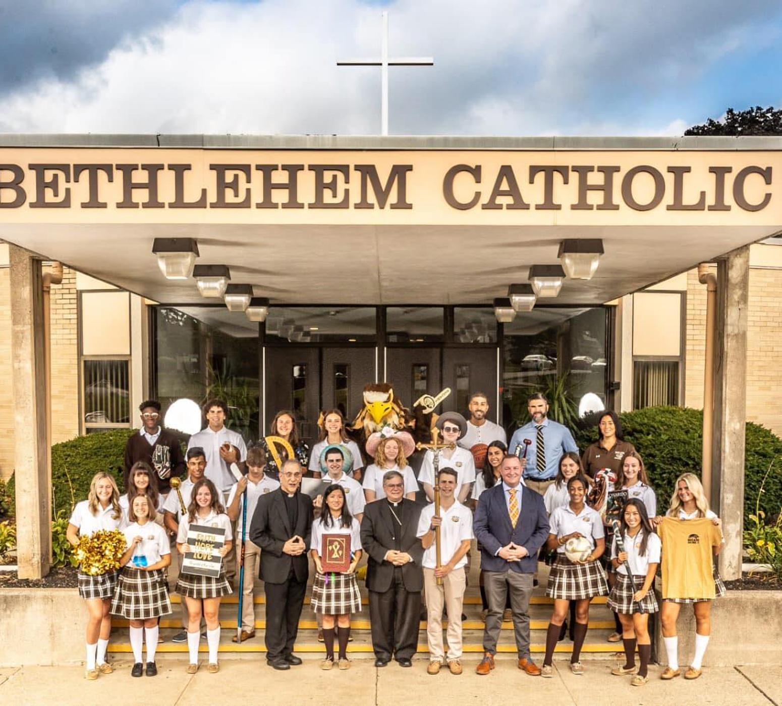 students in front of school building
