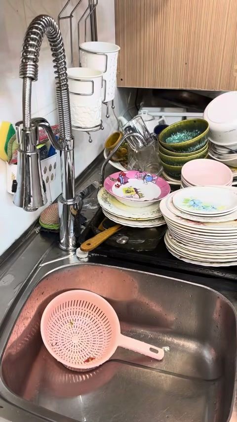 Person thoroughly washing hands at kitchen sink after handling pet food