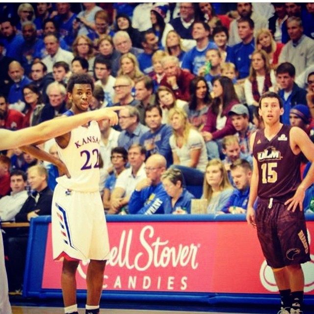 A Kansas player in the number 22 jersey points across court during a game against ULM.