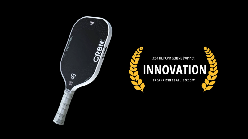 CRBN TruFoam Genesis paddle, black face with white lettering, beside a gold laurel badge reading Innovation.
