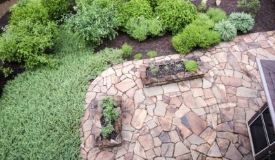 Flagstone vs Interlocking Pavers: Which is Right for Your Alberta Backyard?