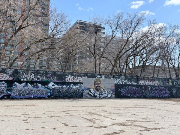 Professional graffiti wildstyle lettering and urban characters on the historic Tech Wall, Ottawa's premier free-speech art zone.