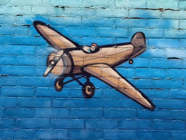 Flying Over street art mural photo 1