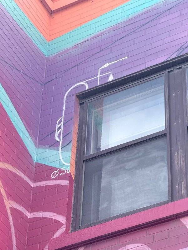 Close-up of the interlocking carabiners in 'HYPNOSE' by Marin Mitrasinovic. This intricate detail serves as a powerful symbol of community solidarity within the Gatineau urban landscape.