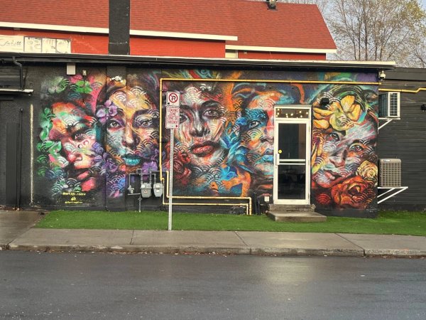 Ottawa street art mural in the Centretown neighborhood, showcasing large-scale figurative and abstract elements.