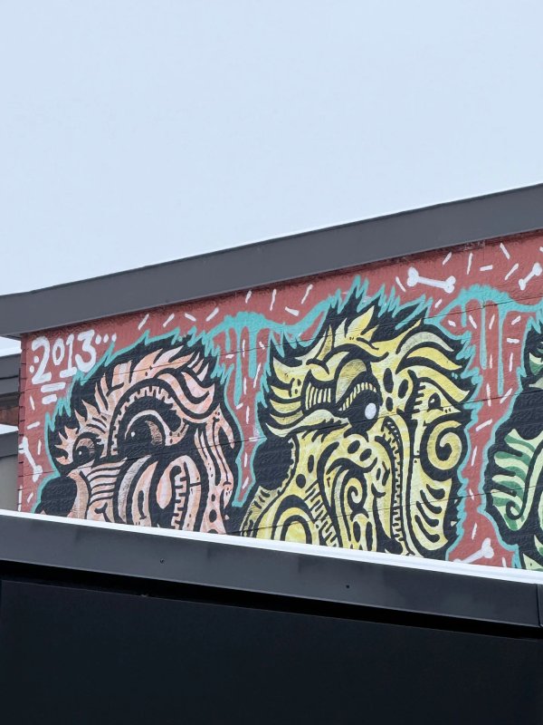 Digital archive entry for OTTAWALLS documenting the urban character illustrations of Lester Jollymore in Ottawa street art scene.