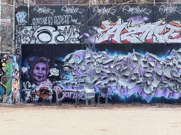 The Tech Wall Ottawa, a famous legal graffiti wall located at Slater Street and Bronson Avenue featuring colorful street art and spray paint pieces.