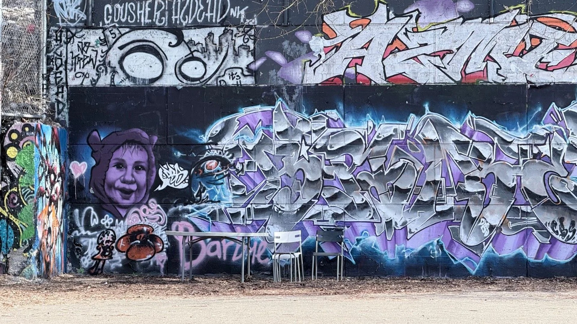 The Tech Wall Ottawa, a famous legal graffiti wall located at Slater Street and Bronson Avenue featuring colorful street art and spray paint pieces.