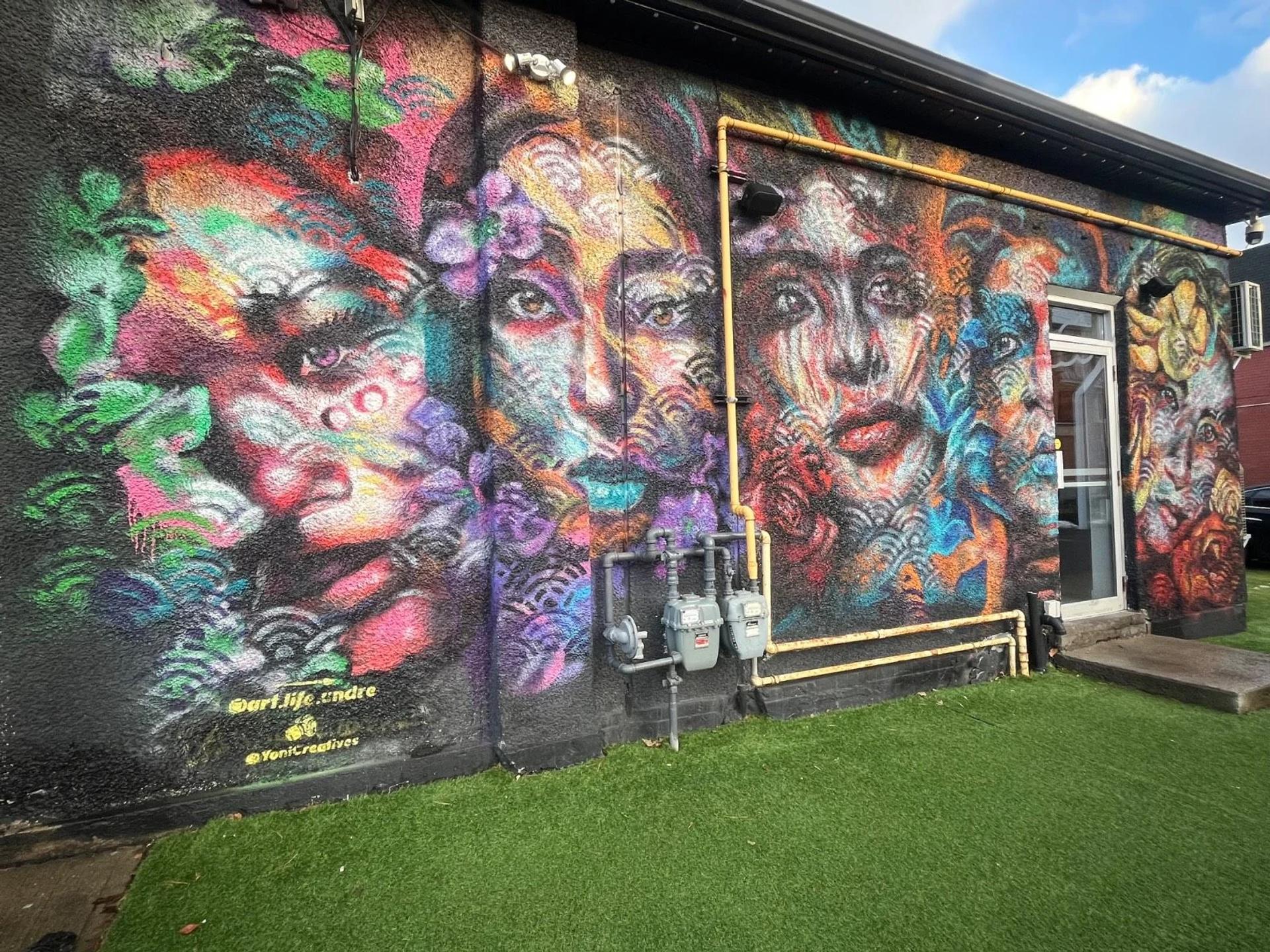 Ottawa street art mural in the Centretown neighborhood, showcasing large-scale figurative and abstract elements.