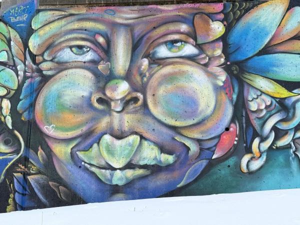 Mural artwork by Mique Michelle - Street art in Byward Market, Ottawa, Ontario