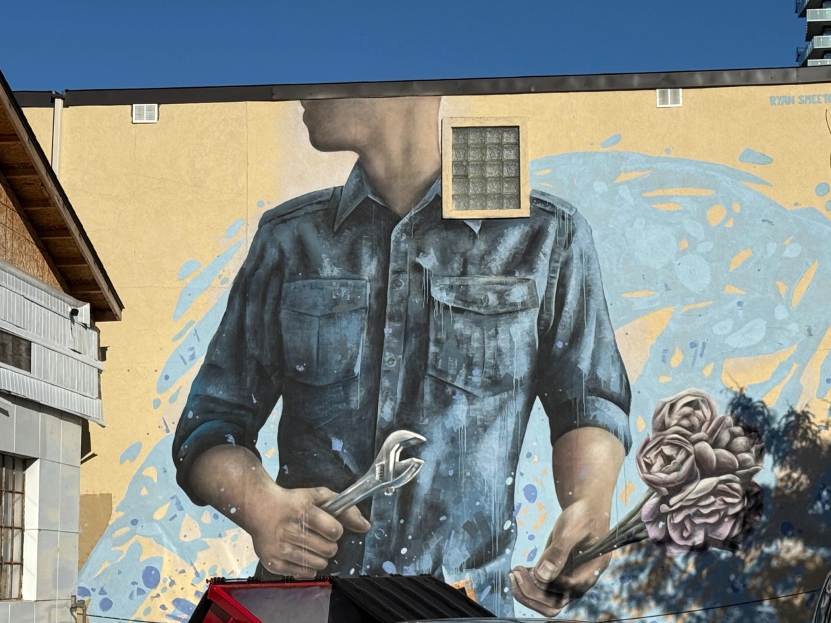 Ryan Smeeton's work of art featuring a mechanic in Hintonburg, Ottawa on Wellington Street West