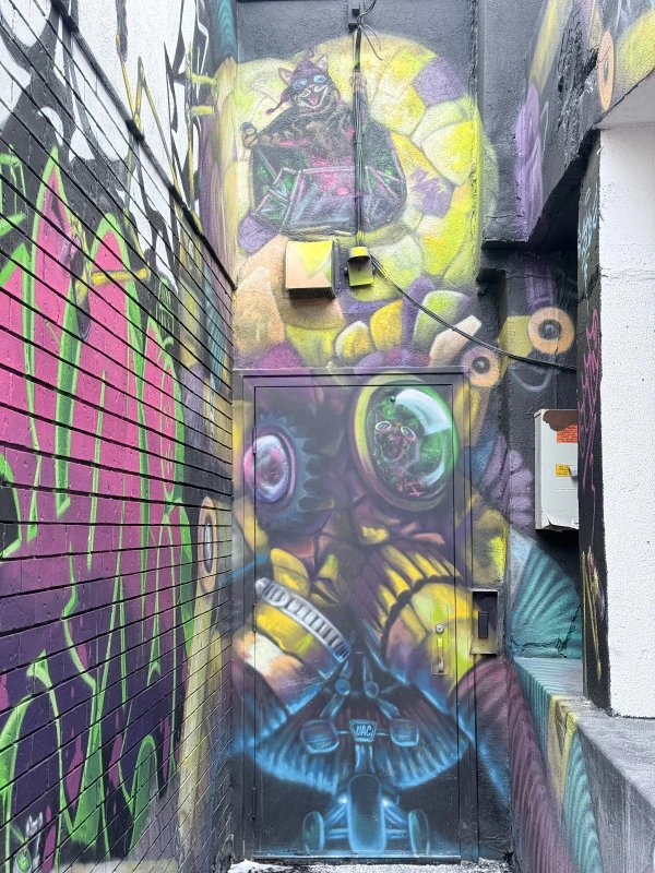 Street view of the Urban Art Collective creative hub featuring the iconic Octobot mural. A must-see location for anyone exploring Ottawa murals and the local urban art archive in Ontario.