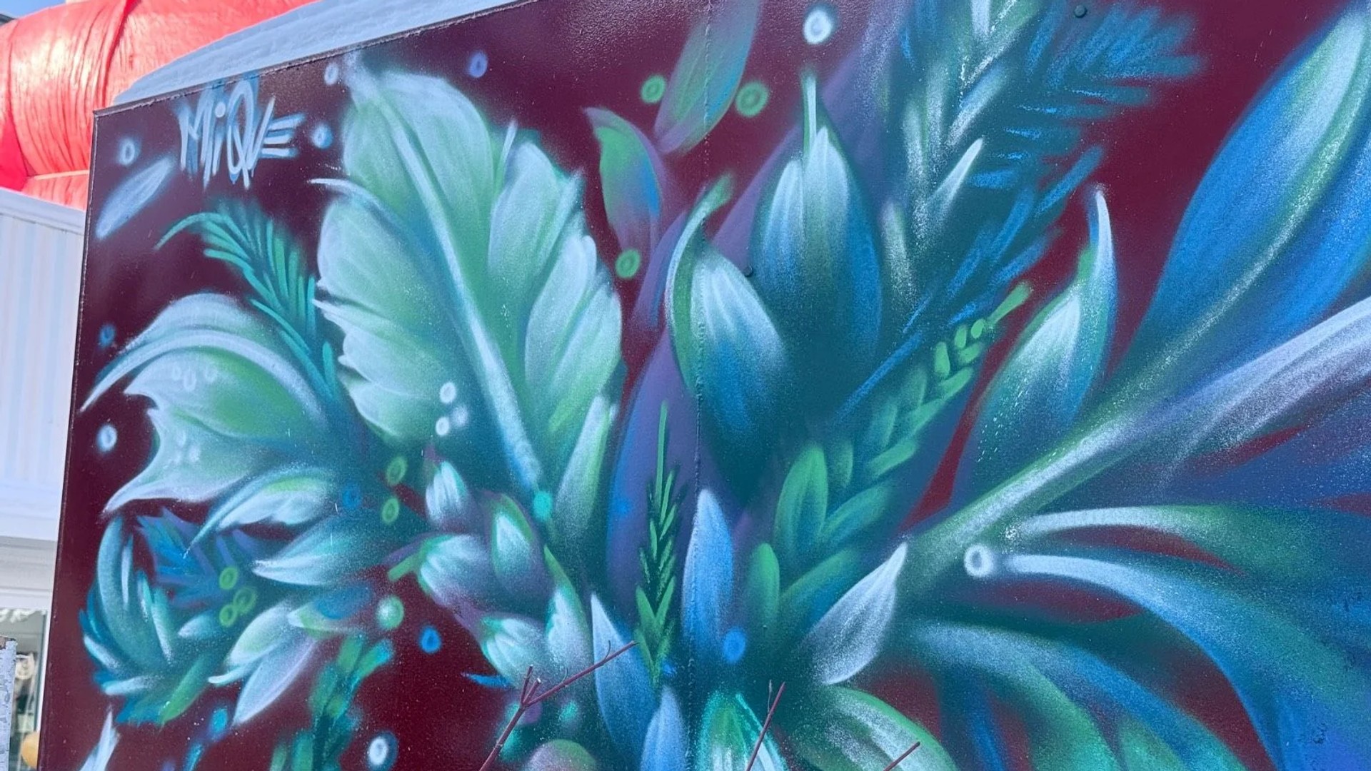 Mural artwork by Mique Michelle - Street art in Byward Market, Ottawa, Ontario