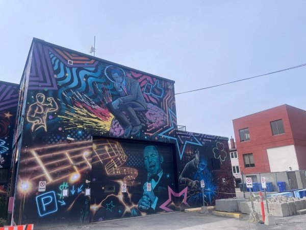 Psychedelic street art detail showing geometric zigzags and squares by artists Phil Landry and Marin Mitrasinovic.