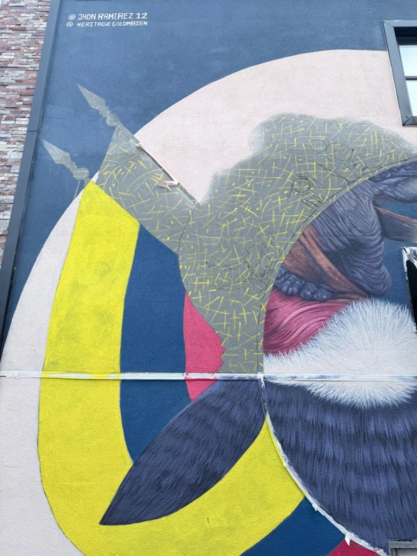 Mural artwork by Jhon Ramirez - Street art in Hull, Ottawa, Ontario