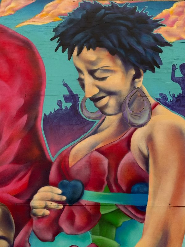 Lowertown Community Art: Powerful portrait mural by DRPN soul celebrating community and identity in Lowertown, Ottawa. Youth-led Public Art.