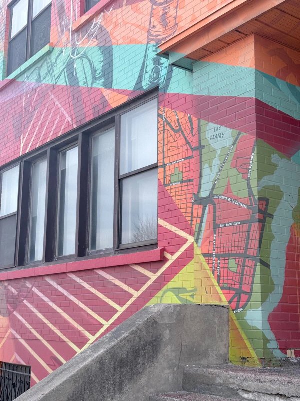 High-contrast detail of aerosol technique in 'HYPNOSE' by Marin Mitrasinovic. Capturing the interplay between traditional mural painting and sharp, modern graffiti lines.