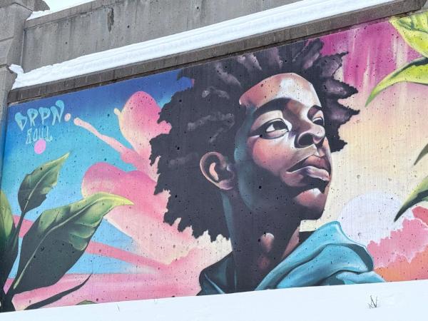 Mural artwork by Kalkidan Assefa - Street art in Byward Market, Ottawa, Ontario