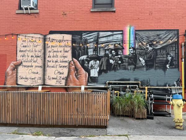 Mural commemorating the "We Demand" 1971 queer civil rights protest, depicting Charlie Hill, located in the Ottawa 2SLGBTQ+ Village.