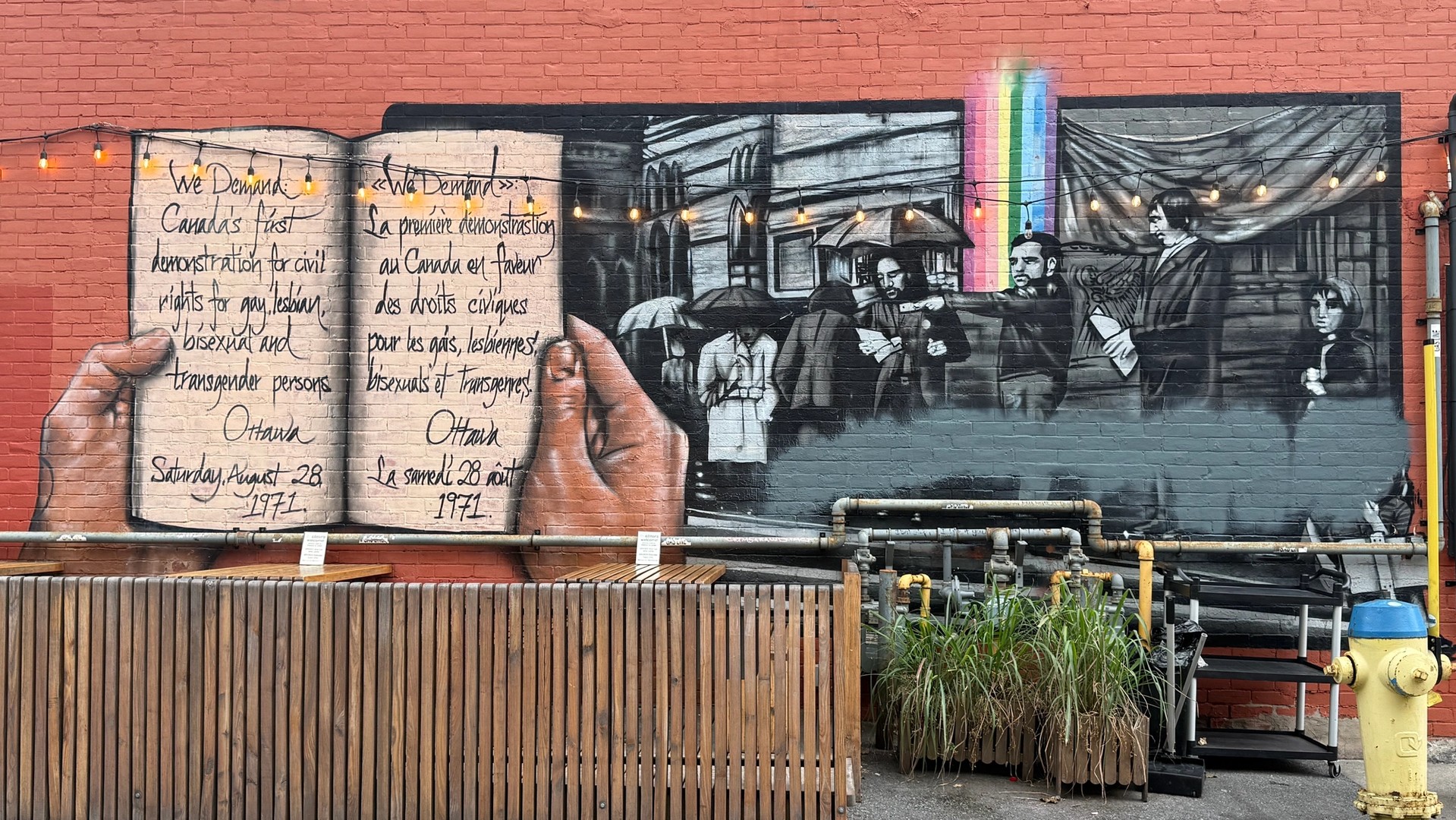 Mural commemorating the "We Demand" 1971 queer civil rights protest, depicting Charlie Hill, located in the Ottawa 2SLGBTQ+ Village.
